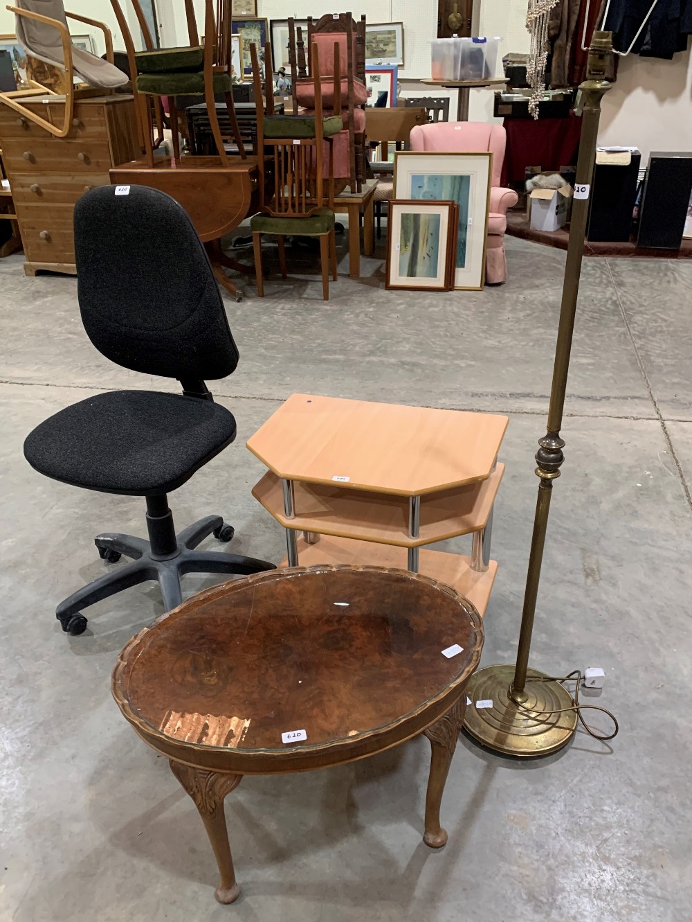 A brass lamp standard; a T.V. stand; an occasional table and an office chair