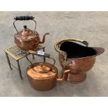 A brass footman; two copper kettles and a copper coal scuttle