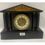 A French slate mantle clock with architectural case, the brass drum movement striking on a coiled