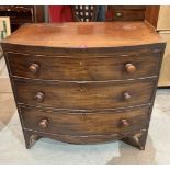 A George III mahogany bowfronted chest of three long drawers on slightly splayed bracket feet.