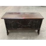 A 17th century oak six plank chest, the chip carved and geometrically decorated lid over front