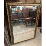 A gilt framed wall mirror. 41' x 29'