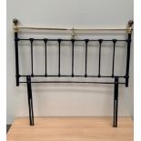 A 4'6' brass and steel headboard