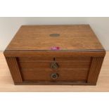 An oak box, the lid with interior mirror, over two drawers flanked by locking stiles. 18' wide