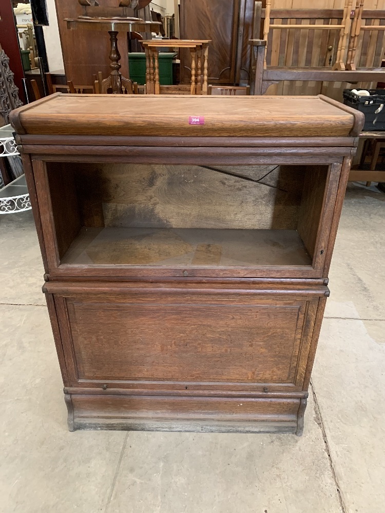 An oak sectional bookcase. 34' wide x 44' high. Glass lacking