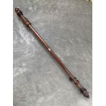 A Victorian mahogany curtain pole with ten rings. 74' long