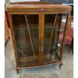 A walnut bowfronted china display cabinet. 34' wide