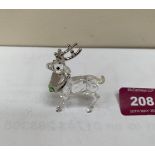 A Swarovski Crystal reindeer. 2' high