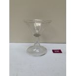 An octagonal wine glass with jewelled rim on trumpet foot. 5' high