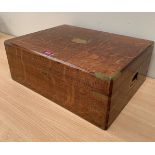 An early 20th century oak and brass bound box. Bears a label for the Army and Navy stores. 17½'