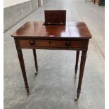 A Regency mahogany writing table, the top with pen and inkwell compartment, over a frieze drawer