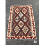 A Choli Kilim rug. 1.25m x 0.83m