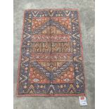 A Kashmiri wool chain rug. 0.86m x 0.59m