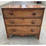 A George III mahogany chest of three long drawers raised on bracket feet. 36' wide. Distressed