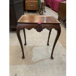 A 19th century mahogany silver table, with shell moulded shaped frieze, on cabriole legs. 20' wide