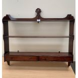 A 19th century mahogany wall rack fitted with two drawers. 36' wide. Finial re-stuck