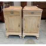 A pair of satin veneered bedside cabinets