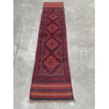 A Meshwani carpet runner. 2.46m x 0.6m