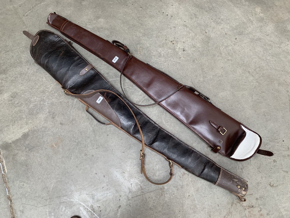 Two leather gun cases