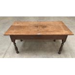 A joined oak low table on baluster turned legs. 43' long