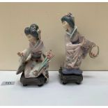 Two Lladro figures of Japanese geishas. The taller 8½' high