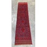 A Meshwani carpet runner. 2.43m x 0.6m