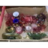 A box of cranberry and other glassware