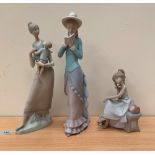 Three Lladro biscuit porcelain figures, the tallest 14' high