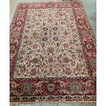 An eastern style Belgian cream ground 'Tabriz' carpet. 160' x 118'