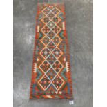 A Choli Kilim carpet runner. 1.9m x 0.61m