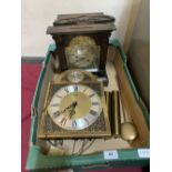 An oak mantle clock (A.F.) and a modern longcase clock movement