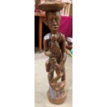 An ethnic carved treen figure. 33' high