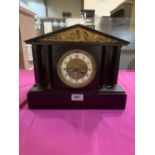 A French slate mantle clock with architectural case, the brass drum movement striking on a coiled