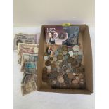 A collection of coins, banknotes and royal commemorative medals