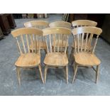 A harlequin set of six lath back kitchen chairs