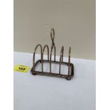 A Victorian silver four division toastrack London 1899. 4' long
