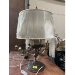 A cast gilt brass four light table lamp
