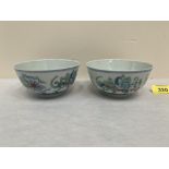 A pair of Chinese famille-verte bowls, blue six figure character marks to bases. 4½' diam.