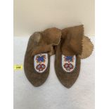 A pair of early 20th century native American leather and beadwork moccasins. Cree tribe