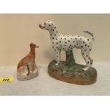 19th century Staffordshire. A figure of a dalmation 6¼' high; together with a hound with hare, 4'