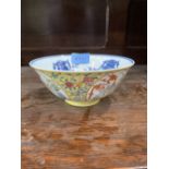 A Chinese famille-heune bowl painted in four reserves with vases of flowers and lanterns. Blue