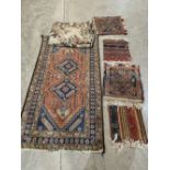 An eastern rug, four saddle bags and an Aubussin style throw. (6)