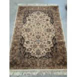 A beige ground eastern style rug. 78' x 55'