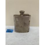 An Elizabeth II silver hip flask. Birmingham 1961. 4¼' high. 5ozs. Dent