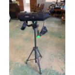 An Opticron spotting scope on tripod stand