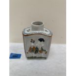 A 19th century tea caddy, moulded with figures in low relief. 4¾' high