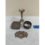 A silver snuffbox (A.F.); a silver gin label; a silver napkin ring and a silver loaded bud vase. 1oz