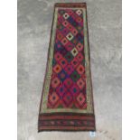 A Suzni Kilim carpet runner. 2.22m x 0.62m