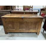 An 18th century joined oak three panel chest, the interior with a till, raised on stiles. 53' wide