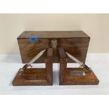 A pair of boxed military oak bookbends, presented to Colonel P.A. Mc D Mayes, on relinquishing